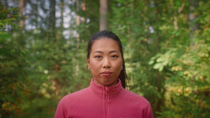 Miki Chen in forest during summer.